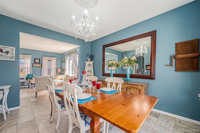 5224 Snow Goose St, Brighton, CO 80601 - dining room featuring a chandelier and baseboards
