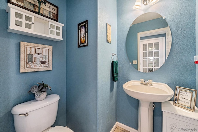 5224 Snow Goose St, Brighton, CO 80601 - bathroom with toilet and a textured wall