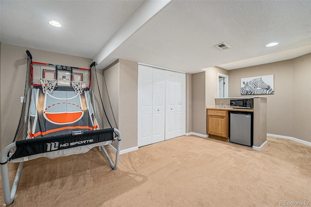 5224 Snow Goose St, Brighton, CO 80601 - interior space with light carpet, baseboards, visible vents, and a textured ceiling