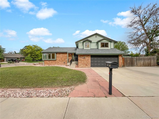 1460 Belmont Dr, Longmont, CO 80503 - tri-level home featuring an attached garage, concrete driveway, brick siding, and roof with shingles