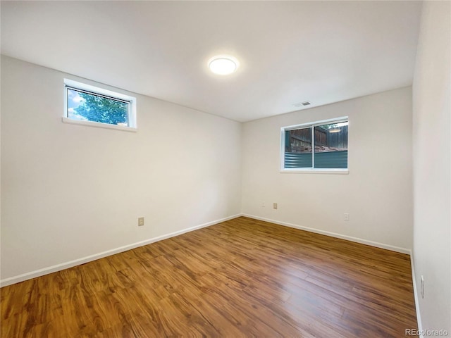 1460 Belmont Dr, Longmont, CO 80503 - unfurnished room featuring wood finished floors and baseboards