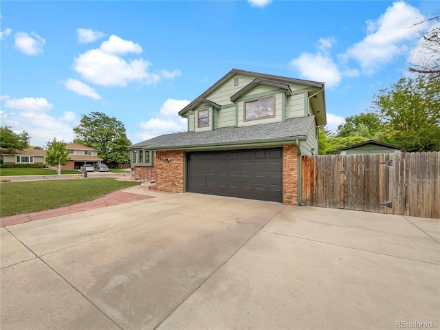 1460 Belmont Dr, Longmont, CO 80503 - traditional home featuring brick siding, a garage, concrete driveway, and roof with shingles