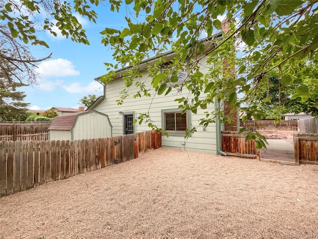 1460 Belmont Dr, Longmont, CO 80503 - rear view of property with a fenced backyard and a shed