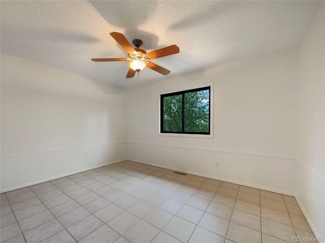 1460 Belmont Dr, Longmont, CO 80503 - unfurnished room with a ceiling fan, a textured ceiling, and light tile patterned floors