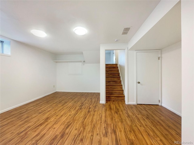 1460 Belmont Dr, Longmont, CO 80503 - below grade area with light wood-style flooring and stairs