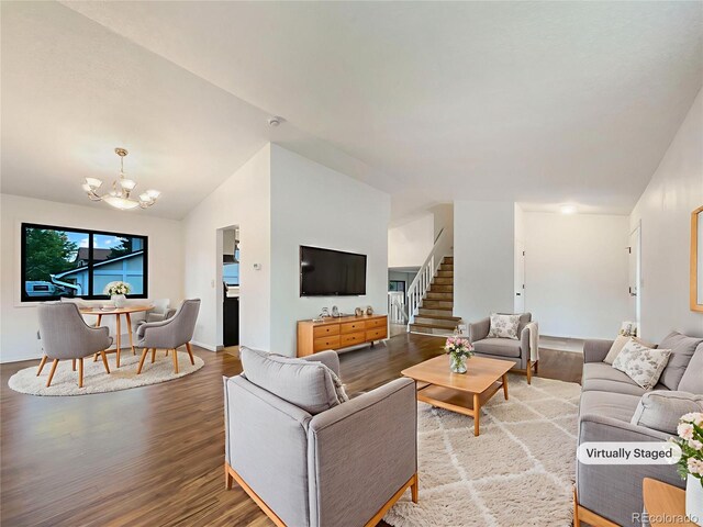 1460 Belmont Dr, Longmont, CO 80503 - living room featuring lofted ceiling, a chandelier, wood finished floors, and stairs