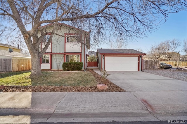 view of front facade with a garage and a front lawn