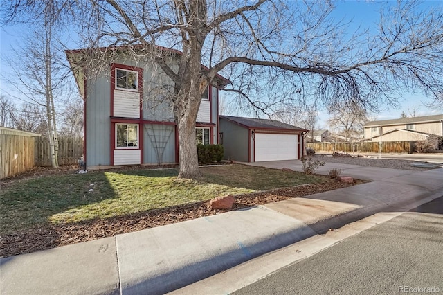 view of front facade with a garage and a front lawn