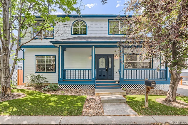 511 Noel Ave, Longmont, CO 80501 - view of front of property with covered porch and a front lawn