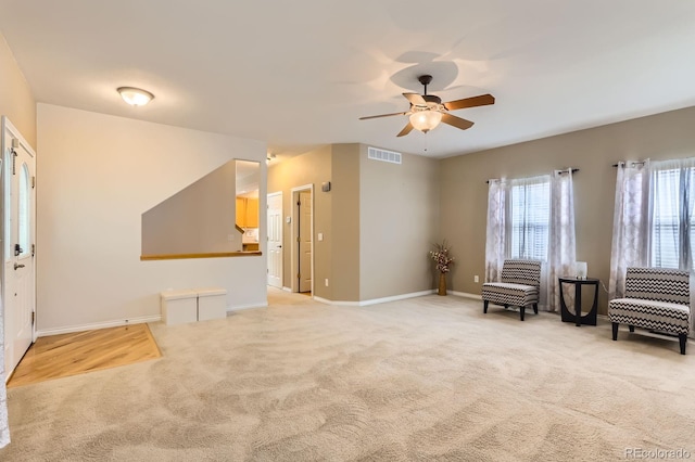 511 Noel Ave, Longmont, CO 80501 - entrance foyer with light colored carpet, ceiling fan, and baseboards