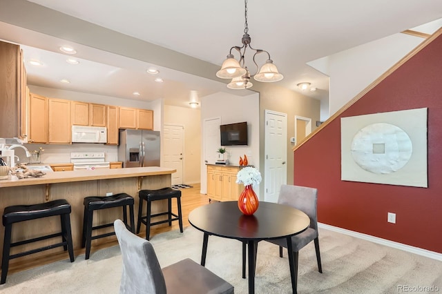 511 Noel Ave, Longmont, CO 80501 - dining space with recessed lighting, a chandelier, and baseboards