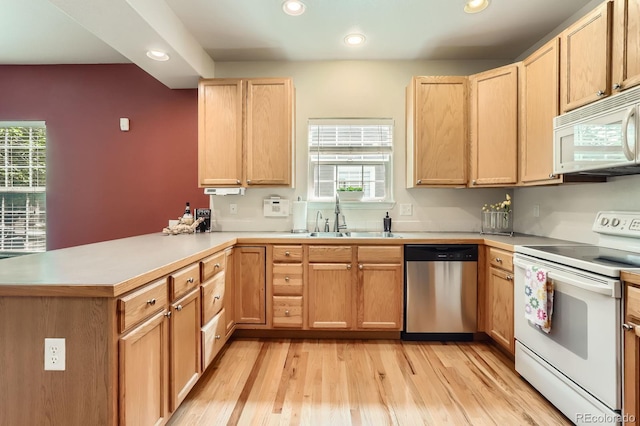 511 Noel Ave, Longmont, CO 80501 - kitchen featuring white appliances, a sink, recessed lighting, a peninsula, and healthy amount of natural light