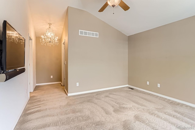 511 Noel Ave, Longmont, CO 80501 - spare room with a ceiling fan, a chandelier, light colored carpet, vaulted ceiling, and baseboards