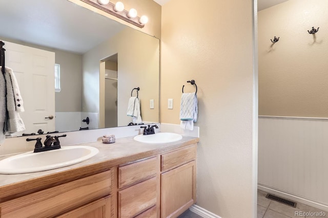 511 Noel Ave, Longmont, CO 80501 - bathroom featuring double vanity and tile patterned floors