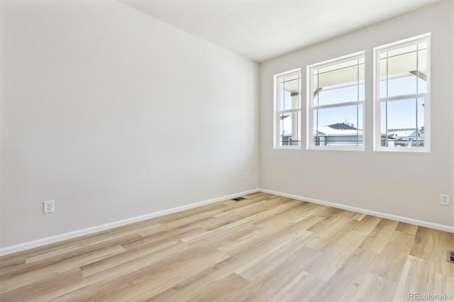 empty room with light wood-type flooring