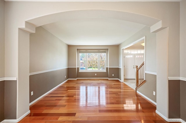 15577 Greenstone Cir, Parker, CO 80134 - spare room with wood finished floors and arched walkways