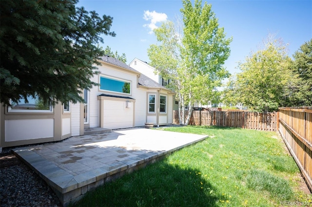 15577 Greenstone Cir, Parker, CO 80134 - fenced backyard with a patio area
