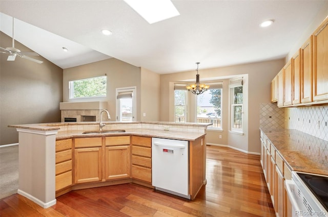 15577 Greenstone Cir, Parker, CO 80134 - kitchen featuring white appliances, light wood-style floors, decorative backsplash, open floor plan, and a chandelier