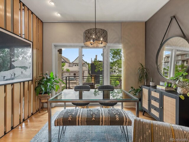 1880 W 32nd Ave, Denver, CO 80211 - dining area featuring light wood finished floors and a chandelier
