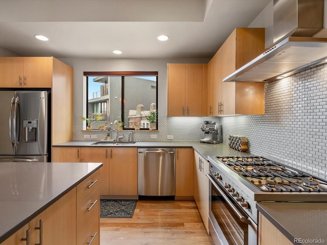 1880 W 32nd Ave, Denver, CO 80211 - kitchen with appliances with stainless steel finishes, exhaust hood, a sink, tasteful backsplash, and light wood finished floors