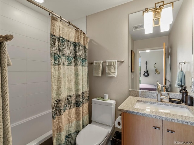 1880 W 32nd Ave, Denver, CO 80211 - bathroom with shower / tub combo, vanity, and toilet