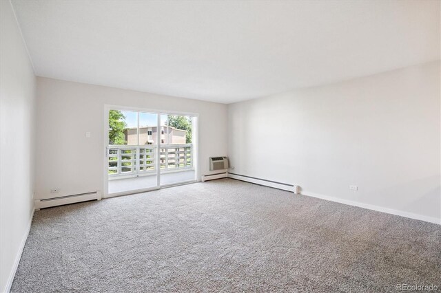 660 S Alton Way Unit 12C, Denver, CO 80247 - spare room with a baseboard heating unit, carpet floors, and a wall unit AC