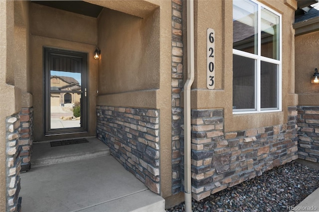 6203 Adamants Dr, Colorado Springs, CO 80924 - property entrance with stone siding and stucco siding