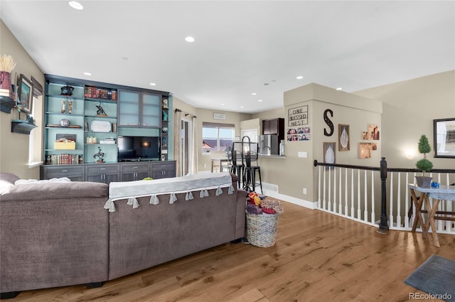 6203 Adamants Dr, Colorado Springs, CO 80924 - living area featuring wood finished floors, baseboards, visible vents, and recessed lighting