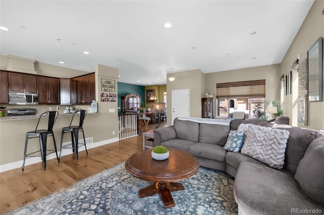 6203 Adamants Dr, Colorado Springs, CO 80924 - living area with light wood-style flooring and recessed lighting