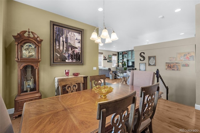6203 Adamants Dr, Colorado Springs, CO 80924 - dining space featuring recessed lighting, an inviting chandelier, and wood finished floors