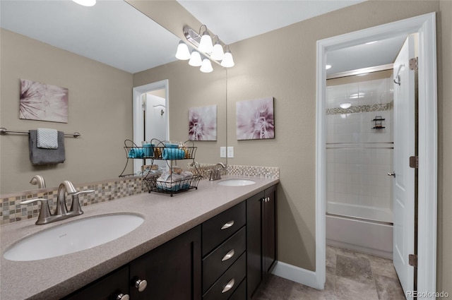 6203 Adamants Dr, Colorado Springs, CO 80924 - bathroom with bath / shower combo with glass door, double vanity, baseboards, and a sink
