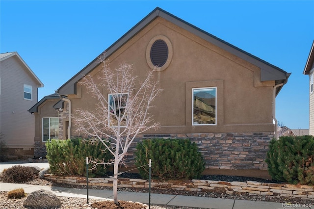 6203 Adamants Dr, Colorado Springs, CO 80924 - view of side of property featuring stone siding and stucco siding