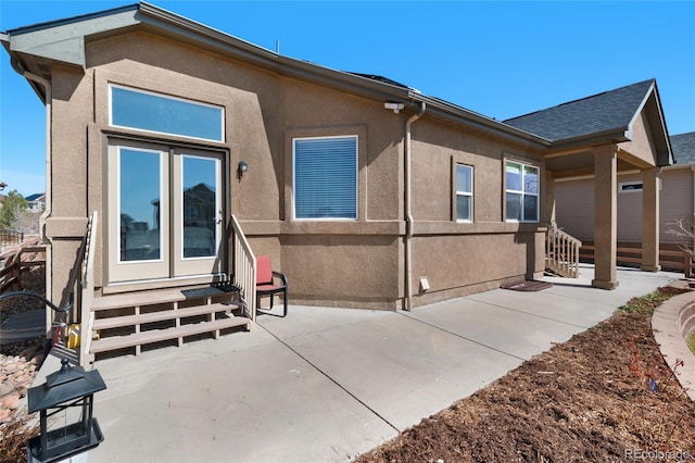 6203 Adamants Dr, Colorado Springs, CO 80924 - view of front of home with a patio, entry steps, fence, and stucco siding