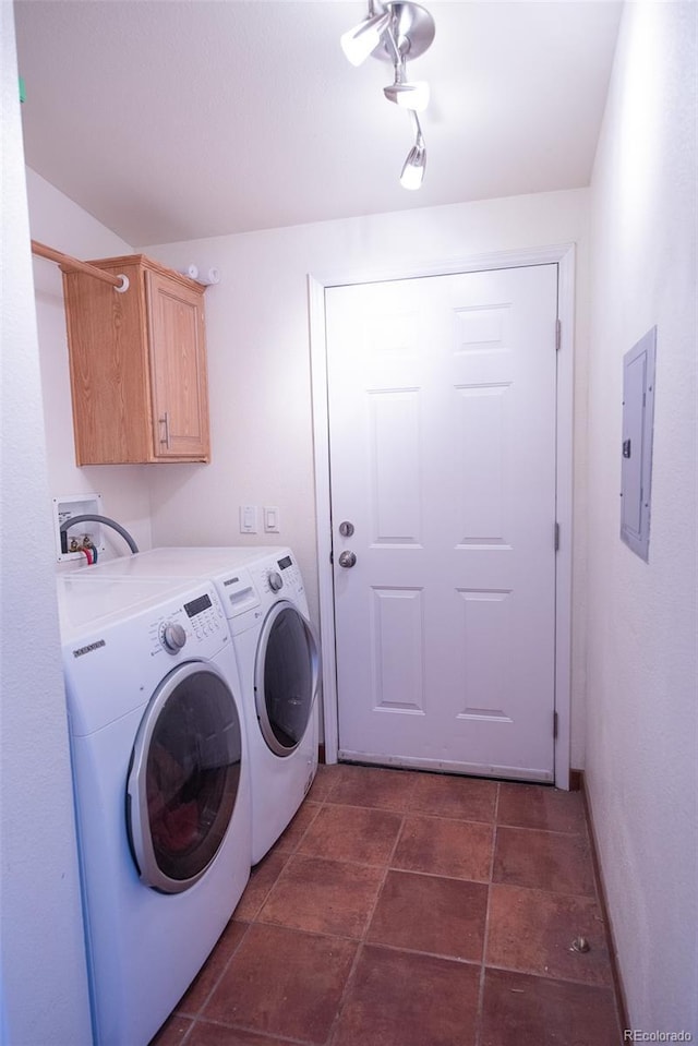 laundry area featuring electric panel, cabinet space, and separate washer and dryer