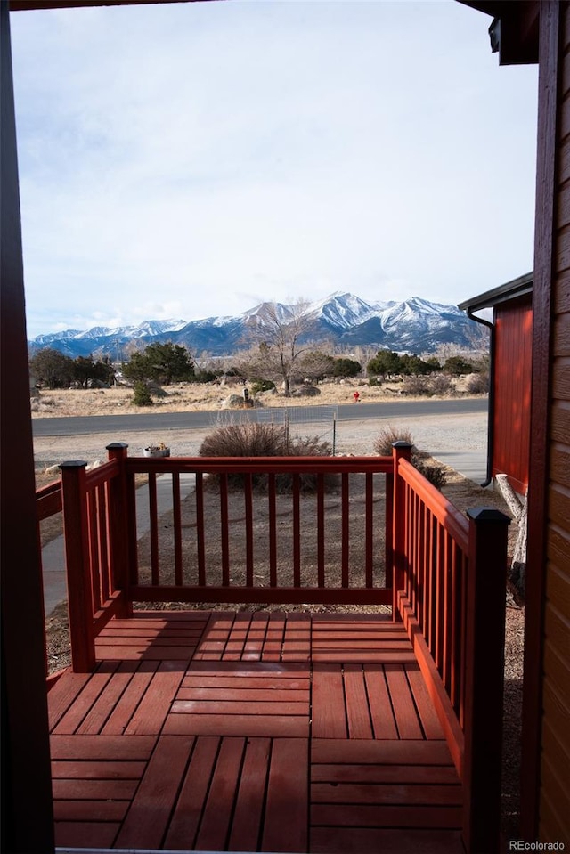 wooden deck featuring a mountain view