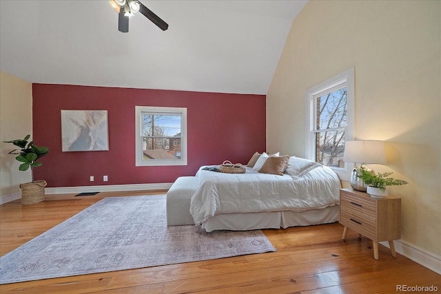 3764 Newton St, Denver, CO 80211 - bedroom featuring multiple windows, hardwood / wood-style floors, vaulted ceiling, and baseboards