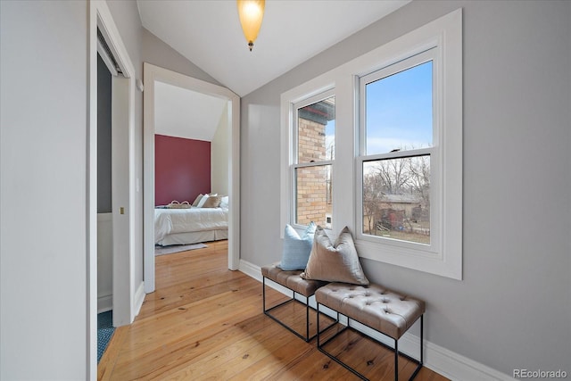 3764 Newton St, Denver, CO 80211 - hallway featuring vaulted ceiling, light wood-style floors, and baseboards