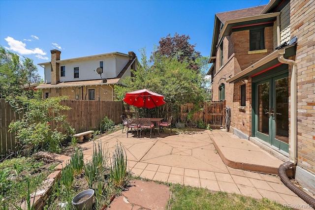 3764 Newton St, Denver, CO 80211 - fenced backyard with french doors and a patio