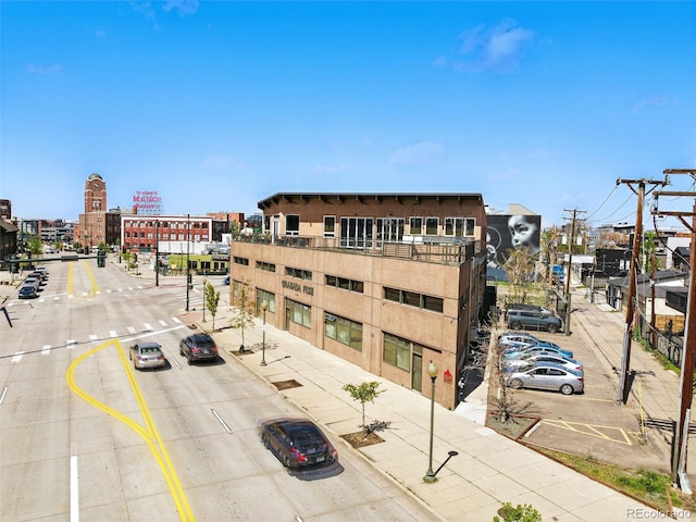 view of commercial property with uncovered parking