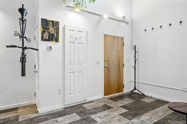 entrance foyer with wood finished floors and baseboards