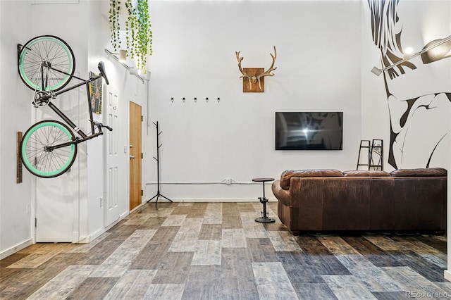 living room with wood finished floors and baseboards