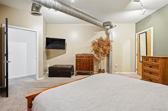 carpeted bedroom with baseboards and ceiling fan