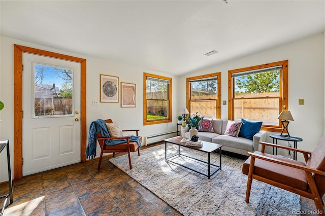 living area featuring stone finish flooring, visible vents, and baseboard heating