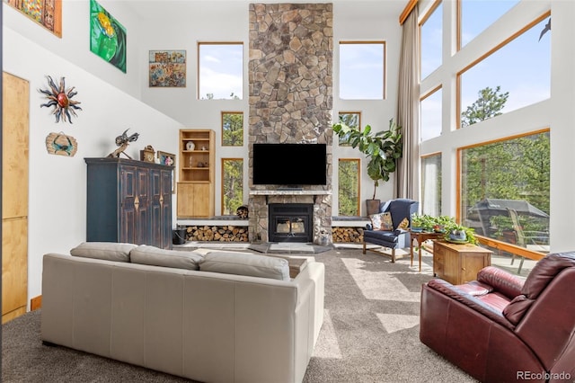 729 Sawmill Rd, Loveland, CO 80537 - living room featuring carpet, a fireplace, and a towering ceiling