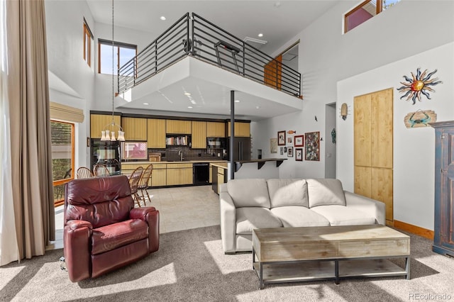 729 Sawmill Rd, Loveland, CO 80537 - living area with a high ceiling, light carpet, a chandelier, baseboards, and recessed lighting