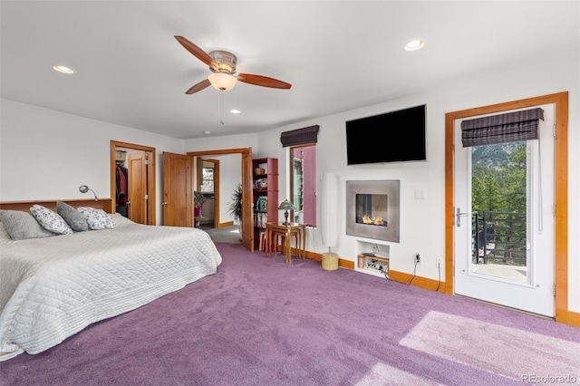 729 Sawmill Rd, Loveland, CO 80537 - bedroom with access to exterior, carpet floors, recessed lighting, a fireplace, and baseboards