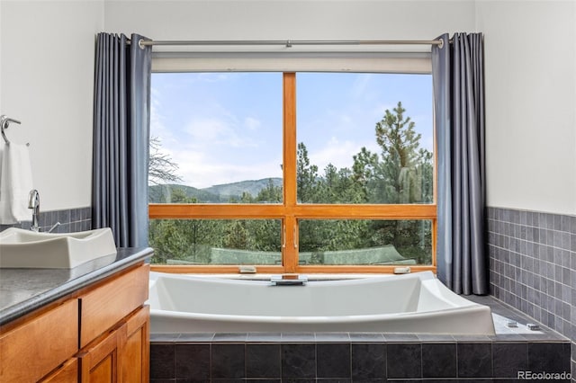 729 Sawmill Rd, Loveland, CO 80537 - full bath with a garden tub, a mountain view, and a sink