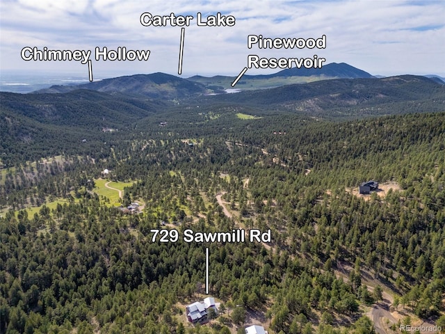 729 Sawmill Rd, Loveland, CO 80537 - bird's eye view of a forest and a mountain backdrop
