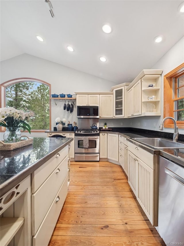 27905 Mariposa Rd, Evergreen, CO 80439 - kitchen with a sink, open shelves, vaulted ceiling, and stainless steel appliances