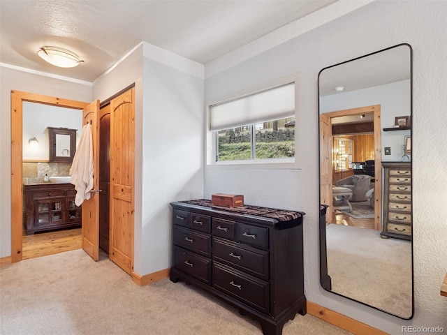27905 Mariposa Rd, Evergreen, CO 80439 - hallway with baseboards and light carpet